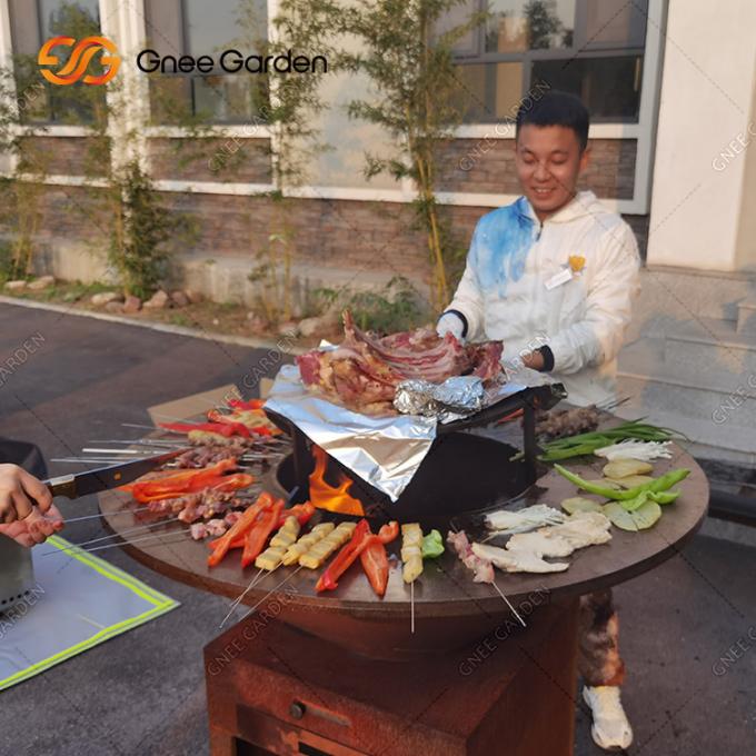 Cozinhando da oxidação exterior do jardim da grade o ASSADO de aço do poço do fogo de Corten grelhe serviços de empacotamento